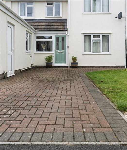 Driveway before pressure washing